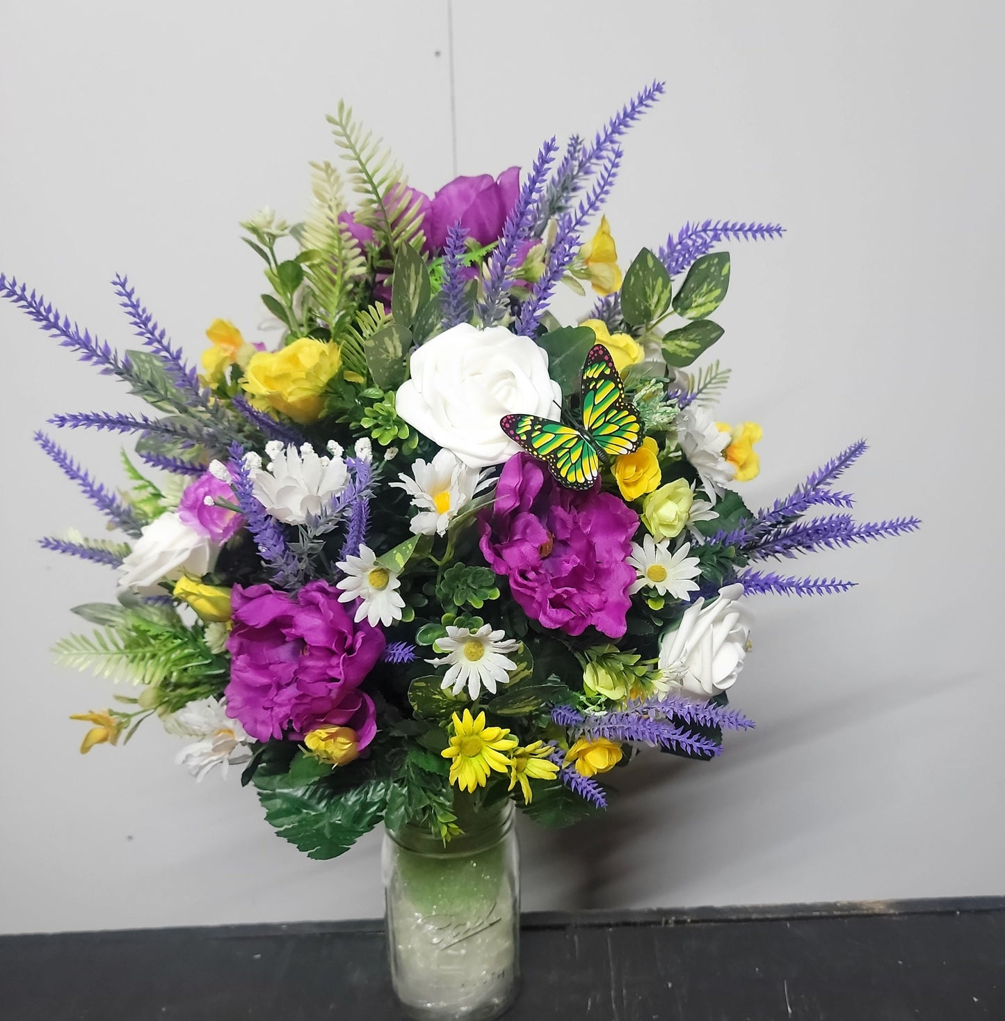 Lavender, white faux roses, yellow sweetheart roses desighned on a styrofoam cone for a 3 inch wide Grave vase , cemetery flowers