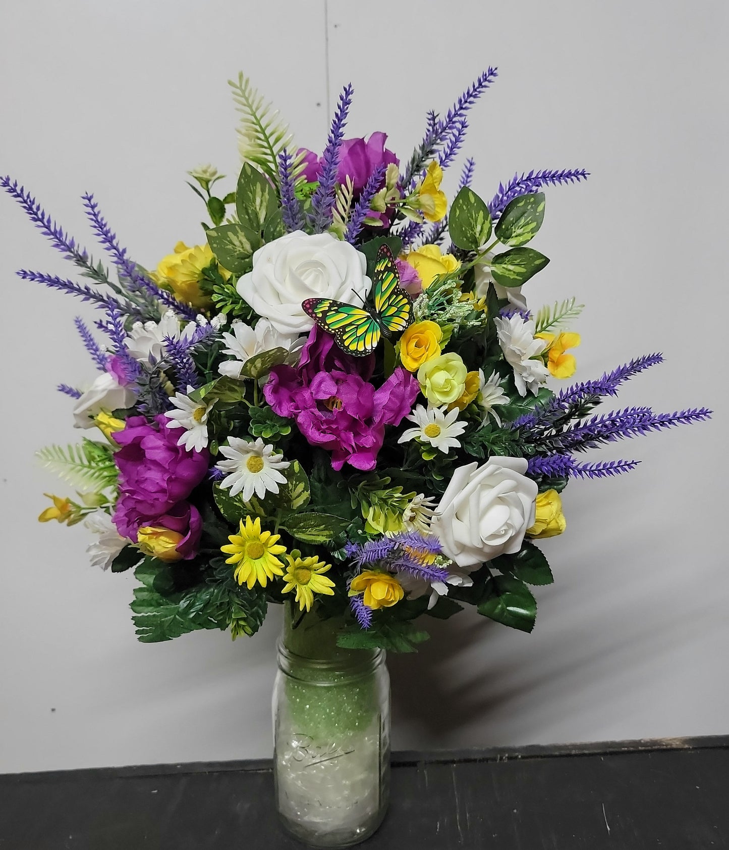 Lavender, white faux roses, yellow sweetheart roses desighned on a styrofoam cone for a 3 inch wide Grave vase , cemetery flowers