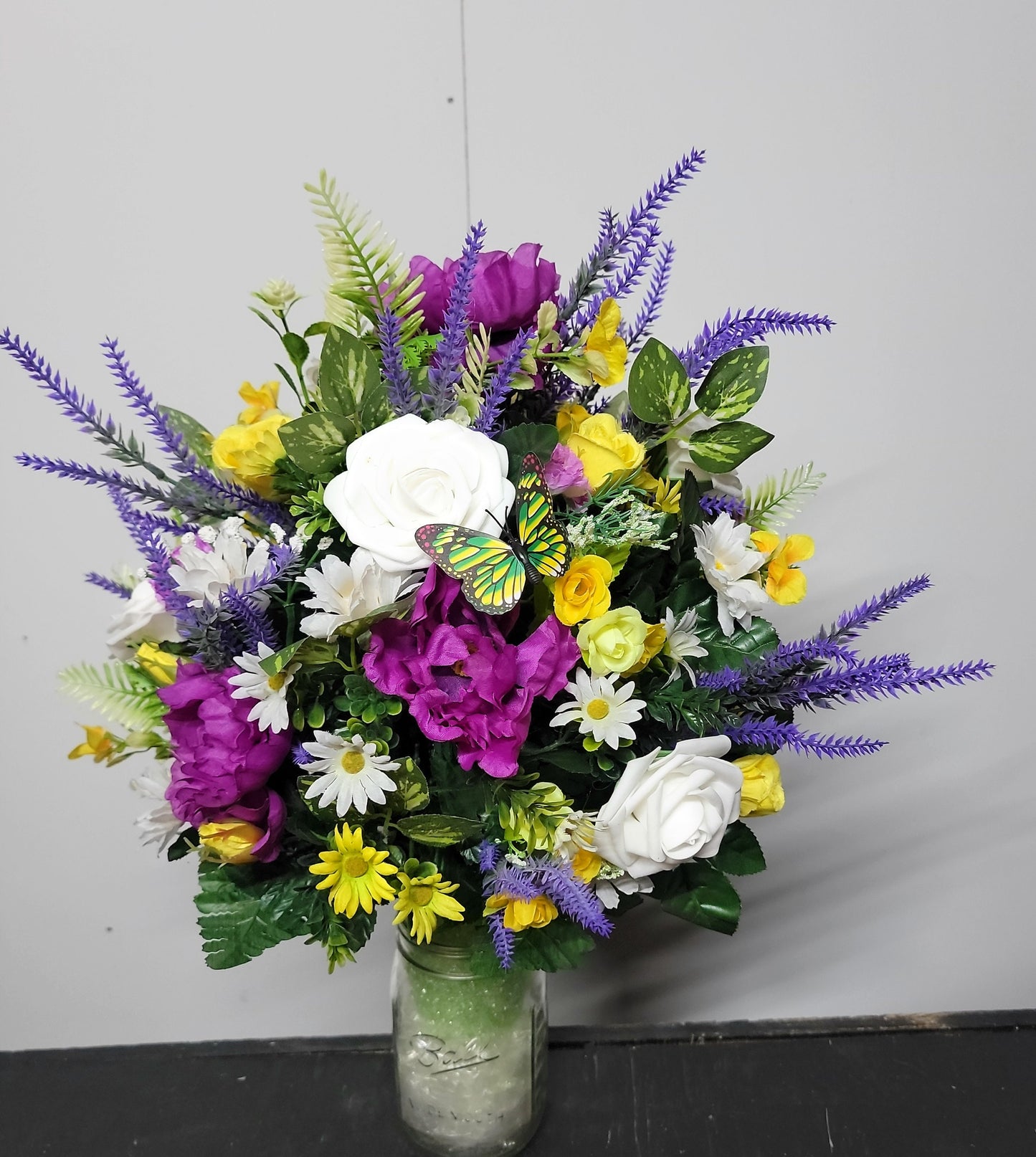 Lavender, white faux roses, yellow sweetheart roses desighned on a styrofoam cone for a 3 inch wide Grave vase , cemetery flowers